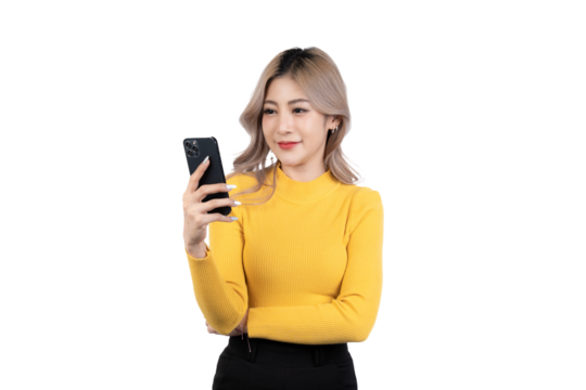 Portrait of a happy asian businesswoman using mobile phone isolated over white background.