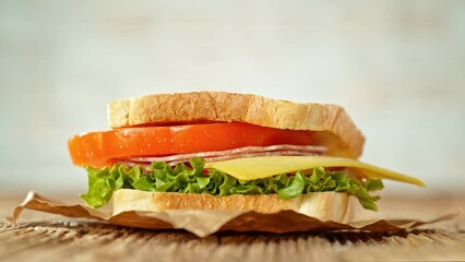 Super slow motion of stacking sandwich pieces. Camera in motion. Filmed on high speed cinema camera, 1000 fps. Placed on high speed cine bot. Speed ramp effect.