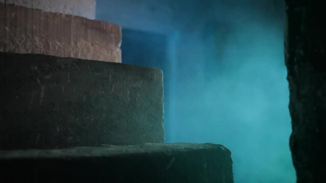Shot of stairs of an abandoned fallen building with fog, HD footage 24 fps. Concept of Halloween.
