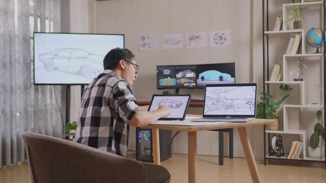 Side View Of Asian Male Yawning And Sleeping While Drawing New Car Design Concept On A Tablet In The Studio With Tv And Computers Display 3D Electric Car Model 
