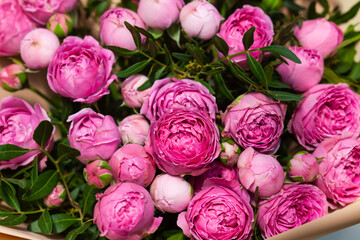 Beautiful bouquet of pink peony roses and eucalyptus leaves. Full frame. © rosinka79