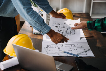 .Engineer Teamwork Meeting, Drawing working on blueprint meeting for project working with partner...