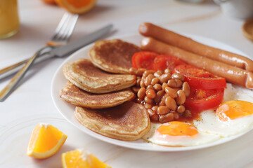 Traditional British breakfast with sausages and beans