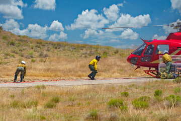 Helitack crew configures the ship for bucket operations
