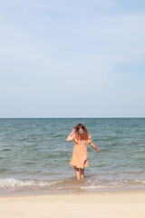Fototapeta na wymiar woman running on beach