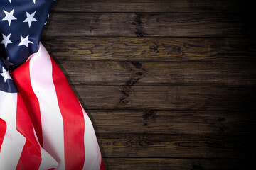 American flag on a wooden texture table and space for text.
