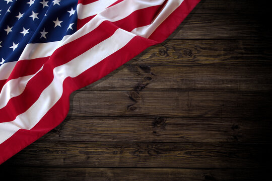 American flag on a wooden texture table and space for text.