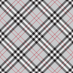 Traditional Scottish checkered plaid ornament. Diagonal vintage tartan texture seamless pattern. Coloured geometric intersecting striped vector illustration. Seamless fabric texture.