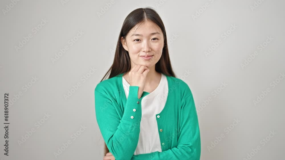 Poster Young chinese woman smiling confident saying yes with head over isolated white background