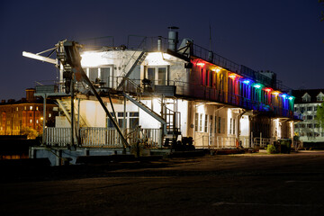 floating platform with colored lights surrounded by light