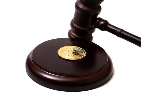 judge's gavel and bitcoin. concept of fraud on the cryptocurrency exchange