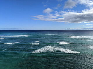 Aerial of Pacific Oeacn with waves rolling in