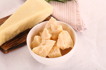 Chopped Italian hard parmesan cheese