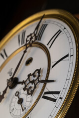 Vintage Clock with Hands.Close up view on clock face of a historical watches with golden frame