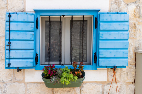 Window with Blue Shutter and Blooming Flowers in Split, Croatia