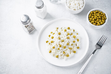 Onion green peas rice in a plate