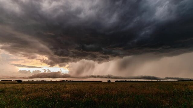 Colorful Supercell Sunset with Mammatus clouds and rainfall Timelapse