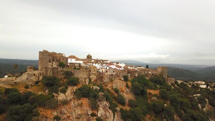 aerial view of Castillo de Castellar, medieval town within a castle in Andalusia at a cloudy day, Castellar de la Frontera, province of Cádiz, Spain © keBu.Medien
