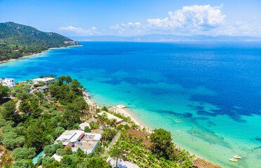 Tropical sand beach with palm trees. La Scala Beach, Thassos, Greece