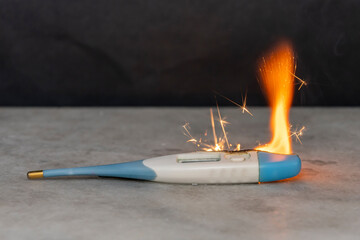 Electronic thermometer burns with fire, flames and sparks. Short circuit, poor contact, battery...