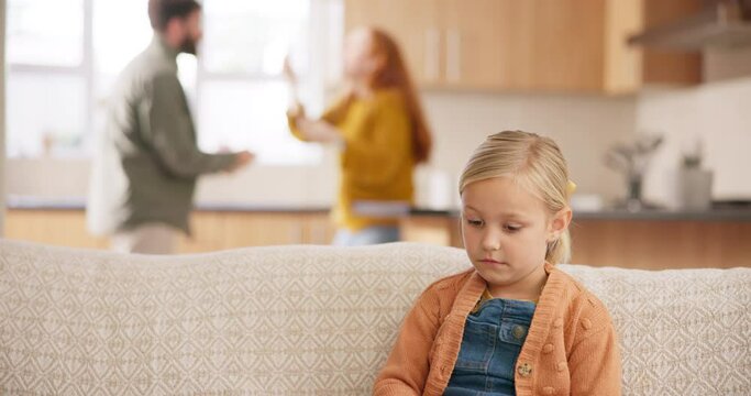 Sad, divorce and parents fighting with a girl sitting on a sofa in the living room of her home during an argument. Fear, stress or anxiety with a daughter watching conflict of her mother and father