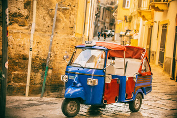 Fototapeta na wymiar Tuk tuk car in streets of Sicily, Italy