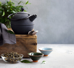 cast iron kettle on wooden table for tea ceremony