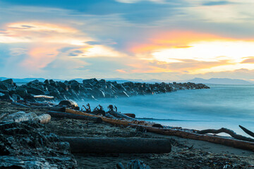 Long-exposure of a dramatic sunset over a beach