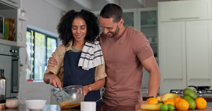 Happy couple cooking in kitchen with hug, love and care for quality time together at home. Young man embrace woman while preparing food for a lunch meal, dinner and romantic bonding in apartment