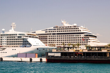 Fototapeta na wymiar Large and luxury cruise ships are moored at port in Kusadasi of Turkey