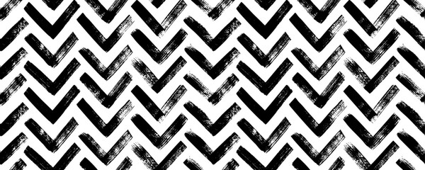 Brush drawn chevron seamless banner. Sketchy style zigzag motif. Vector ink background with rough bold stripes. Tribal ethnic vector texture. Aztec style ornament. Geometric chevron abstract pattern.