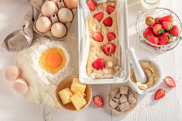 Sweet strawberry yeast cake with fruits and crumble.