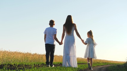 mother child daughter son walk sunset, hold hands. happy family, wheat field, chidhood dream, enjoying summer, dream becoming pilot plane, happy family parents child, little kids, active happy group