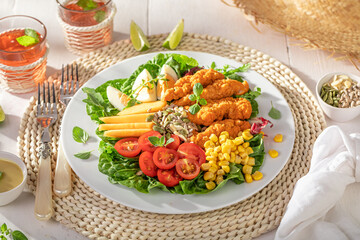 Delicious salad served with mustard sauce and lemonade.