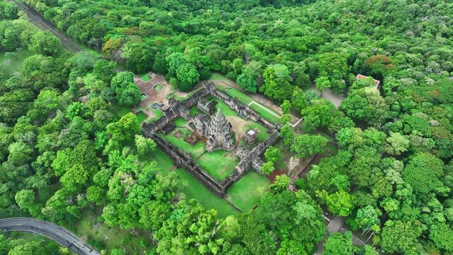 Aerial view of Khao Phanom Rung historical site, Buriram, Thailand, In the morning and it's surrounded by green trees.