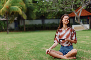 woman blogger phone call palm smiling nature grass lifestyle park tree happy