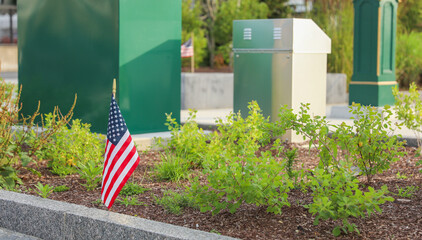 US flag waves proudly in front of an American home, representing the meaning and symbolism of...