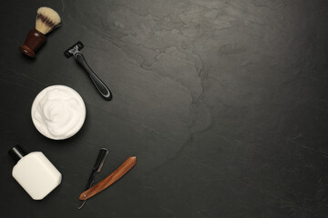 Fototapeta na wymiar Set of men's shaving tools on black textured table, flat lay. Space for text