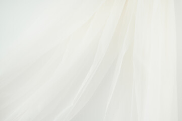 Ivory or White Sheer Chiffon Fabric Hanging on White Background