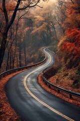Fototapeta premium scenic winding road through a fall forest, created with generative ai