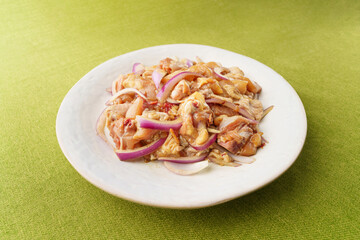 Fresh chicken thigh pieces on a monochrome background