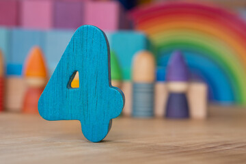 Wooden 4 on rainbow background