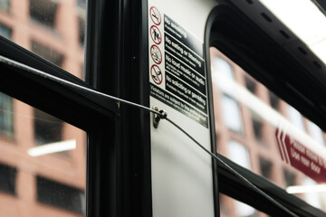 Close-up of bus passenger pull cord to request stop