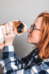 girl and a guinea pig