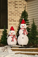 Two Electric Snowmen Outdoors