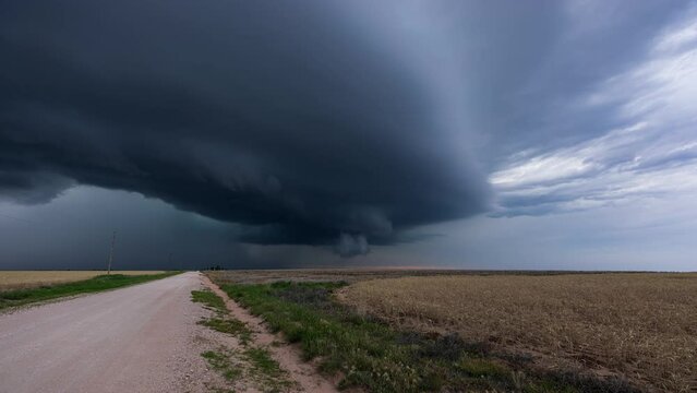 Beautiful Supercell moving over Oklahoma's dirt roads and landscape time lapse
