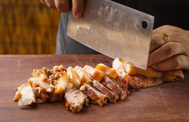 Fresh pork head being sliced