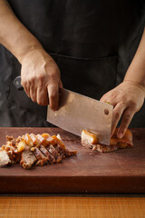 Fresh pork head being sliced