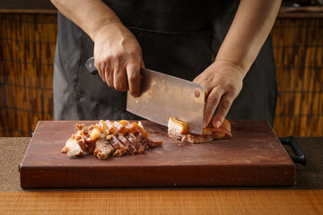 Fresh pork head being sliced