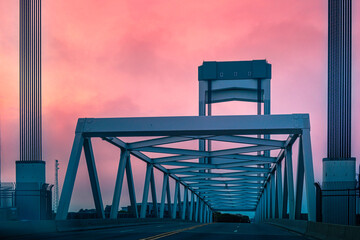 Abstract geometry of an old metal bridge. Sunset over Andrew McArdle Bridge in Boston,...